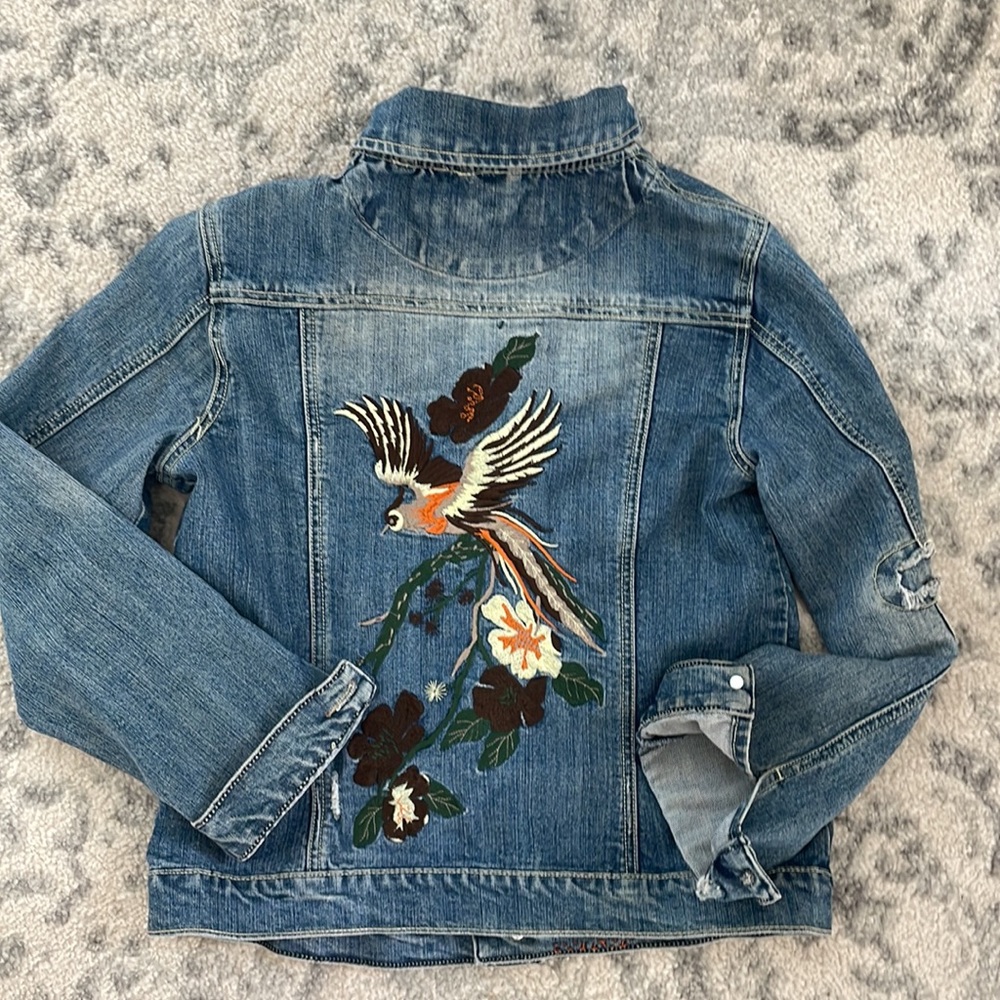 Vanilla Sky Platinum jean jacket with embroidered bird design